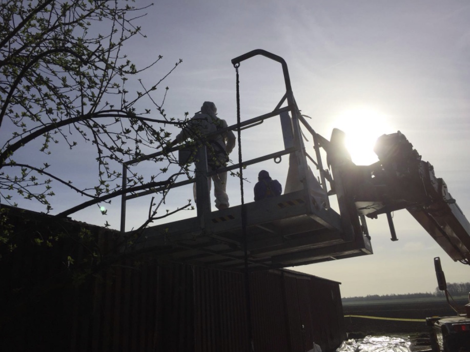 Credim crew on an aerial platform at a roofing site
