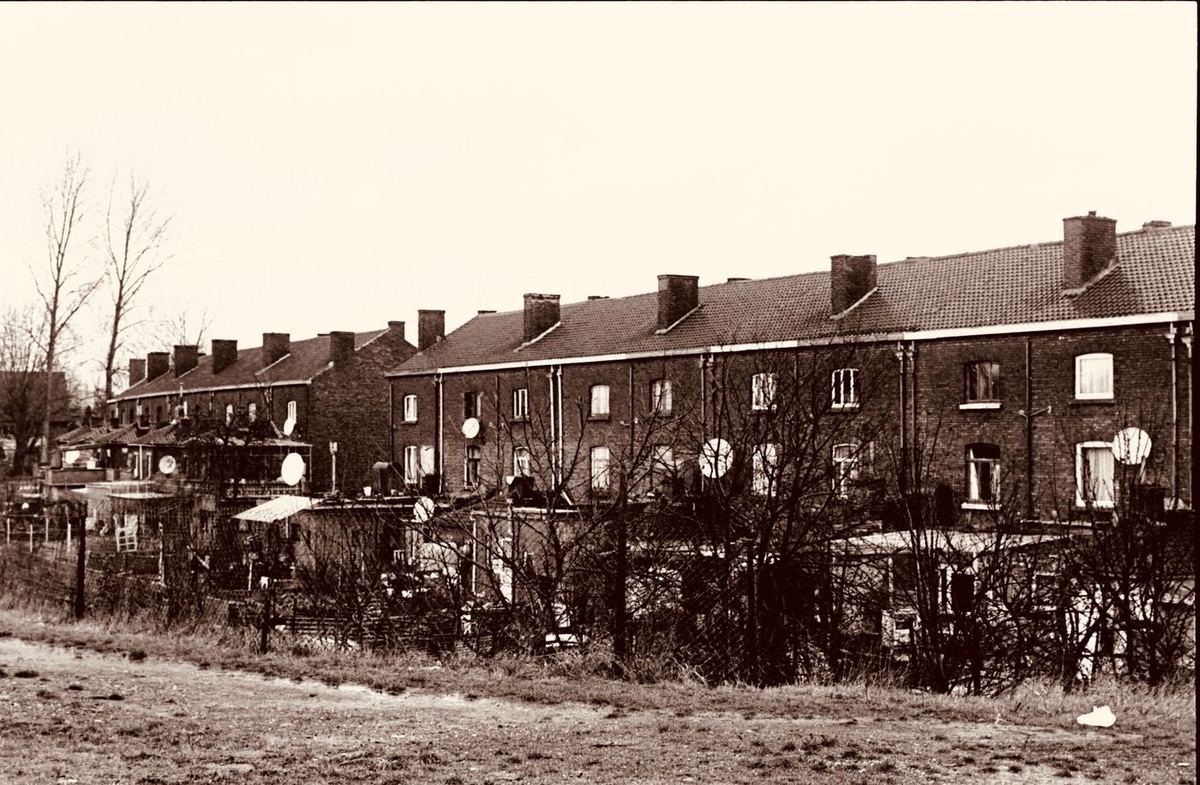 Row of old terraced houses in sepia tones