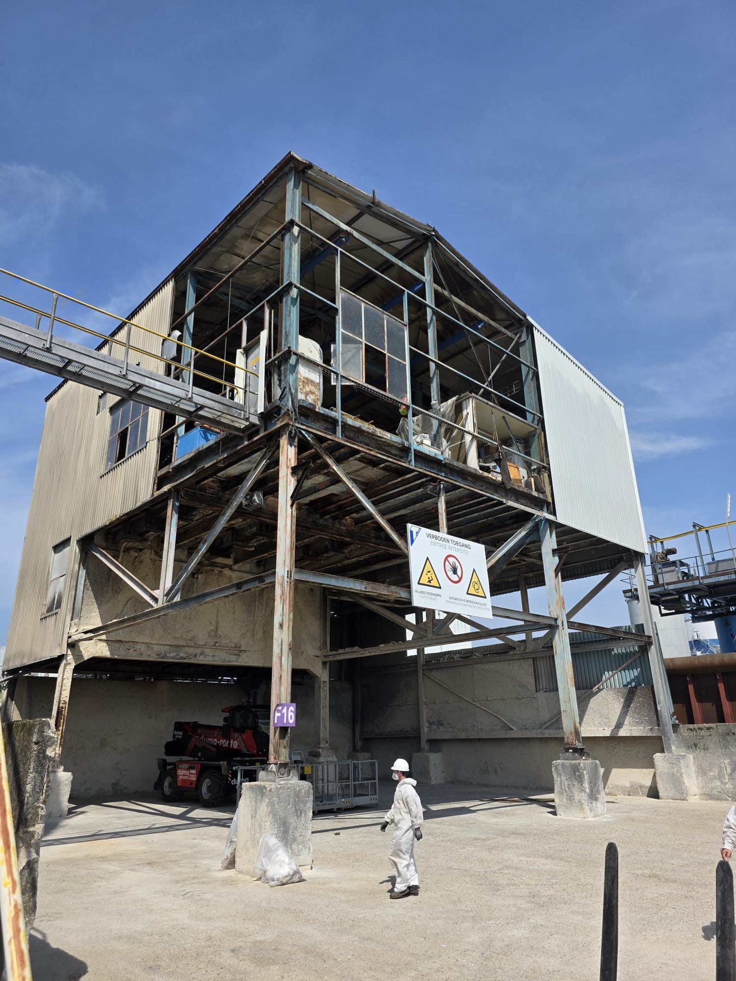 Industrial building with its facade cladding partly removed