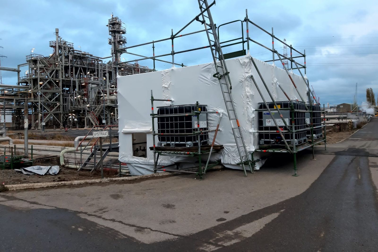 Hermetic zone in white sheeting with scaffolding on an industrial site