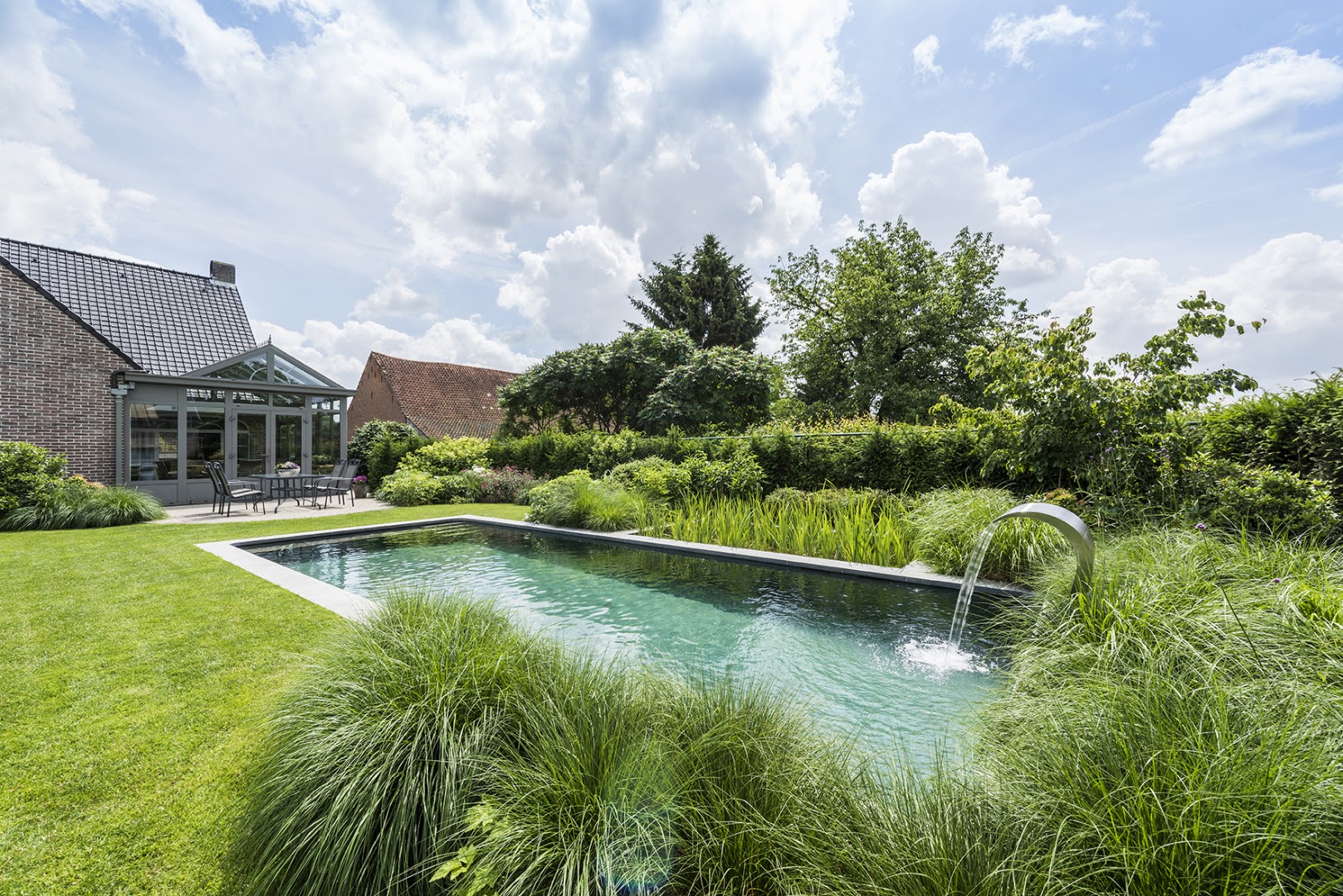 Foto van Gostar Zwemvijver - Biopool - Tuinarchitectuur - Totaalprojecten in Ranst, Zwemvijverbouwer (foto 1)